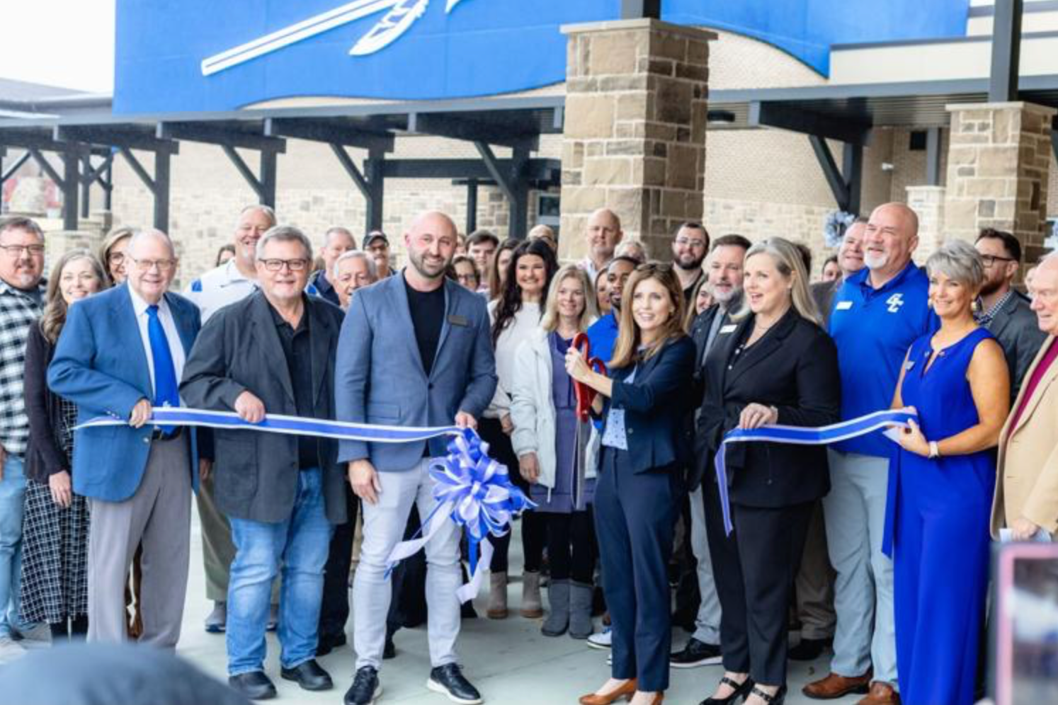 Picture of Gordon Central cutting ribbon on renovations